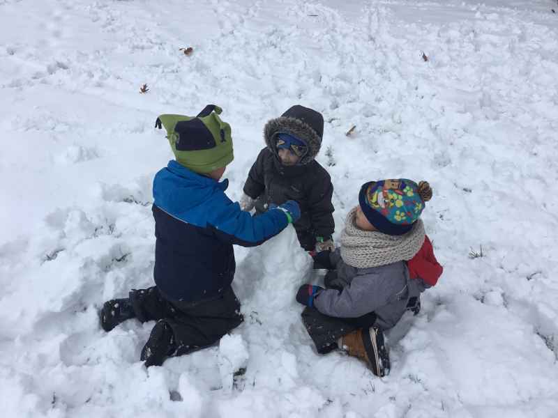 boys making a snowman